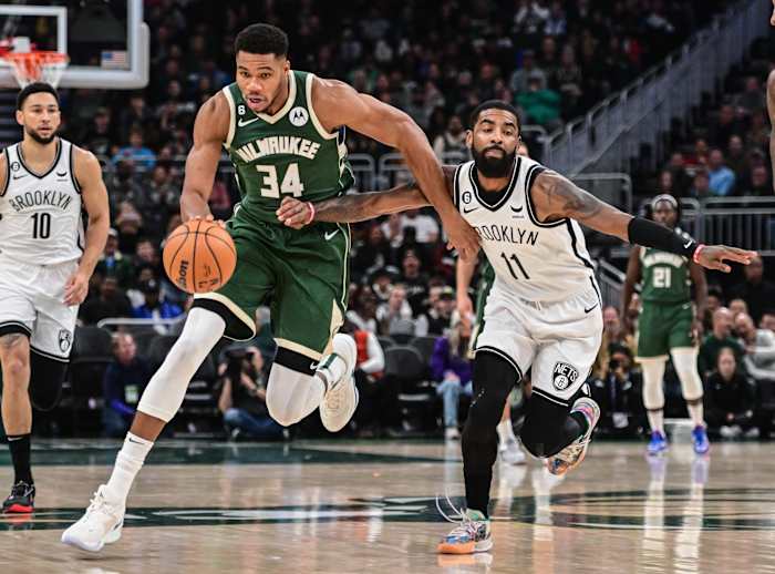 Milwaukee Bucks forward Giannis Antetokounmpo (34) drives to the basket against Brooklyn Nets guard Kyrie Irving (11)